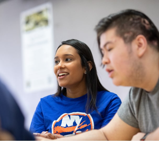 Two students talking in class